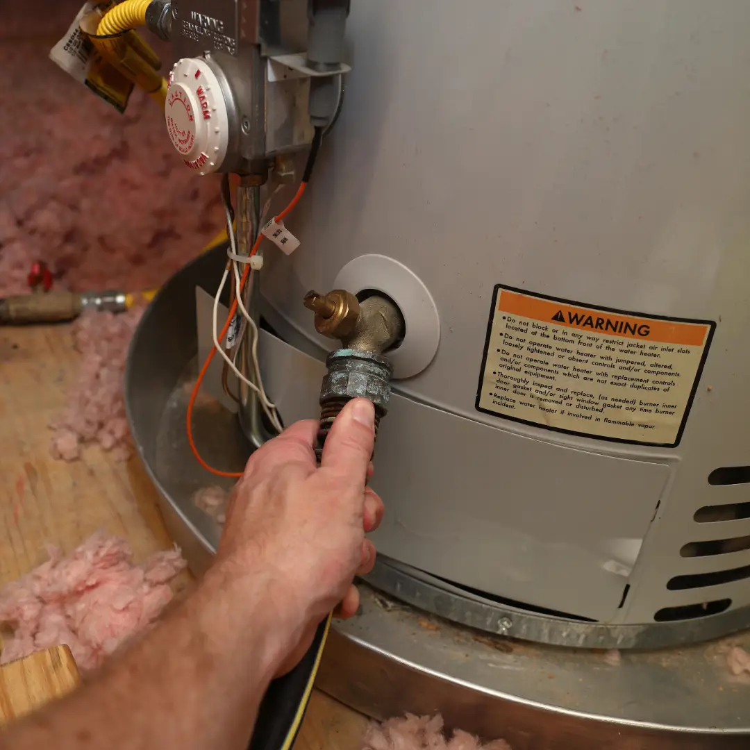 Plumber repairing hot water heater